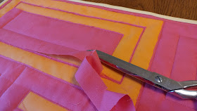 Cutting away fabric layers for reverse applique