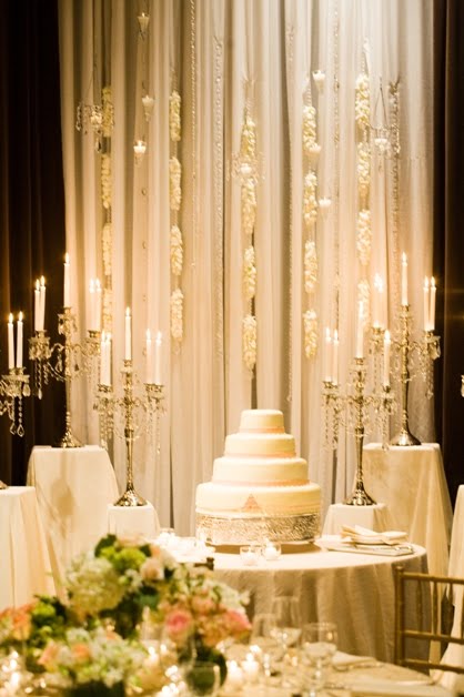 The reception tables were draped in gold embroidered overlays and two 