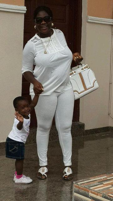 Mercy johnson looking heavily pregnant with daughter Purity.