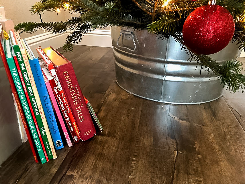 Galvanized Bucket for the Christmas Tree Stand with Christmas books next to it