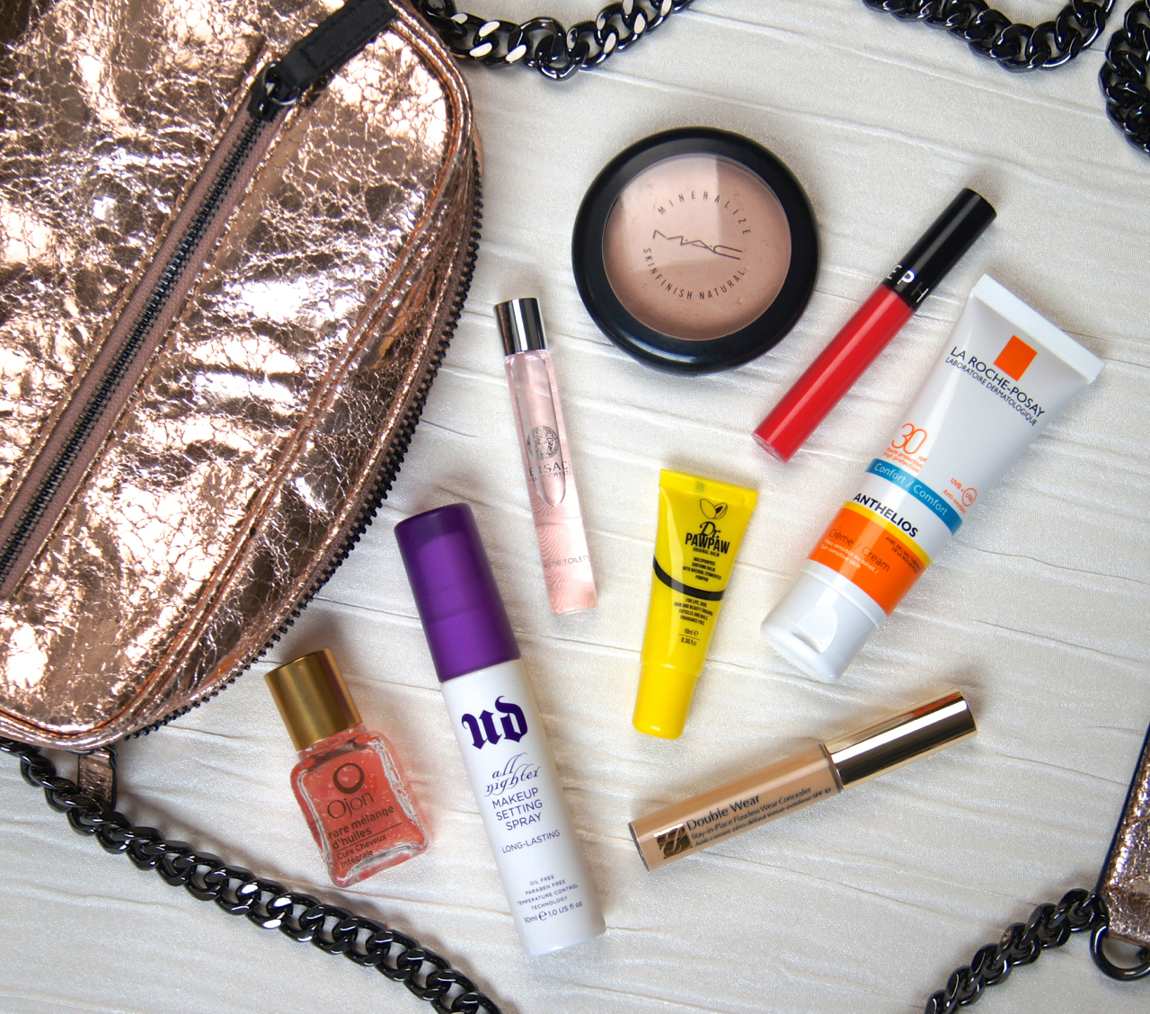 summer beauty what's in my handbag essentials spf powder concealer fragrance setting spray hair oil bright lipstick