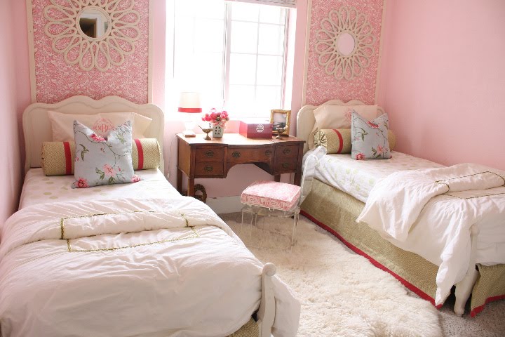 I just love pink. The wallpaper behind each bed.