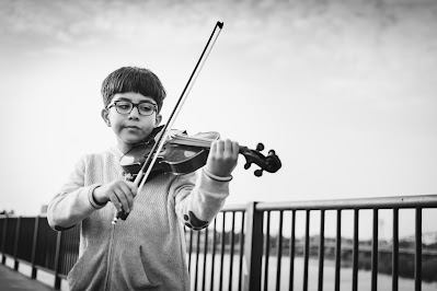 boy practicing violin