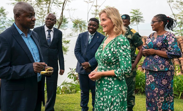 Countess of Wessex wore a green stormy hearts midi tea dress by Suzannah. TRIAL International in Bukavu