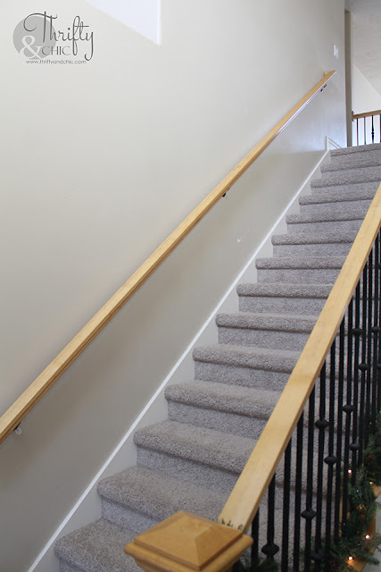 DIY board and batten staircase makeover. DIY stair makeover. How to hang board and batten on stairs. Staircase board and batten tutorial. Staircase ideas. Entry way decor and decorating ideas. Staircase decor and decorating ideas. Two story entryway ideas. Two story entry way ideas.