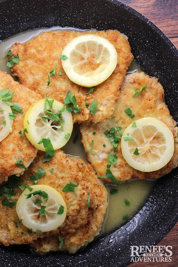 Pork Chops Romano in Lemon Butter Sauce in pan ready to serve