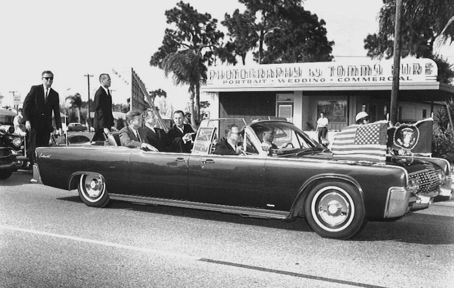 SAs Don Lawton & Chuck Zboril on rear of JFK's limo 11/18/63 Tampa, FL