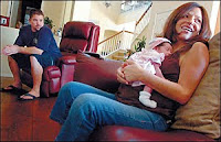 Robert and Araceli Hooker with their new daughter, Kaylyn Hope, on Aug. 20 at their home in Corona. (Jennifer Cappuccio-Maher/Staff Photographer)