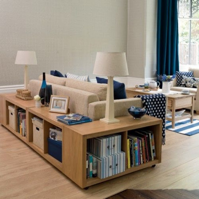 minimalist l shaped wood sofa table with storage cabinets on the laminate wood floor with two white table lamps