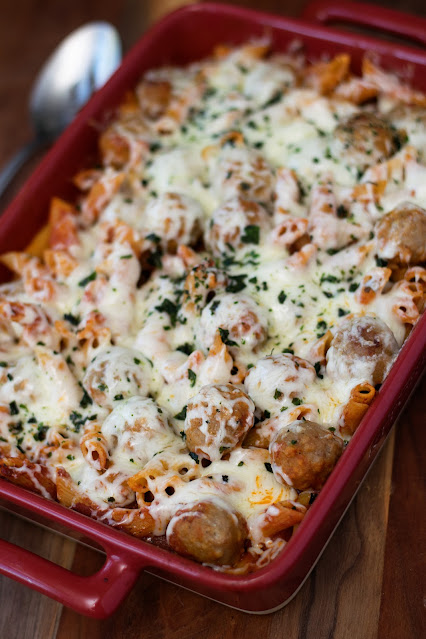 A baking dish full of the one pot cheesy meatball and pasta bake.
