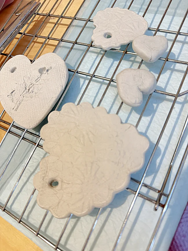 clay hearts on drying rack