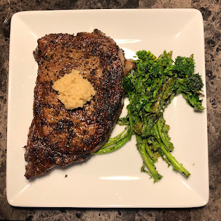 Rare grilled ribeye with grilled broccoli rabe