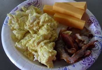Scrambled Eggs, Bacon, and Cheddar Cheese Sticks for Breakfast