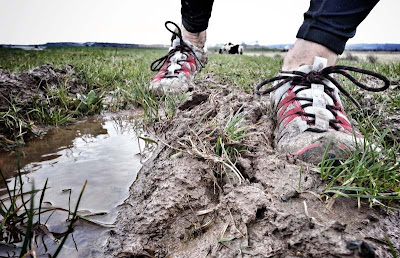 Running in Vivobarefoot Breatho Trails on a cross country, muddy run