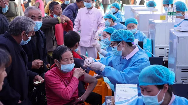 China gives one-billionth Covid-19 shot as Brazil toll hits milestone