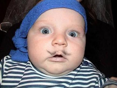 Funny baby with moustache.