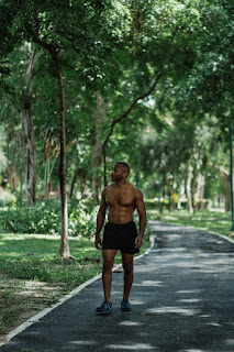 Bodybuilder walking bare chest in the road