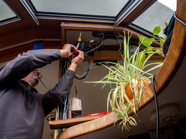 Photo of Phil fitting our new VHF radio