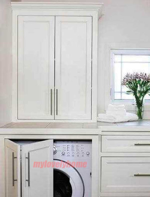 Cabinet With Folding Doors to Hide Washer and Dryer