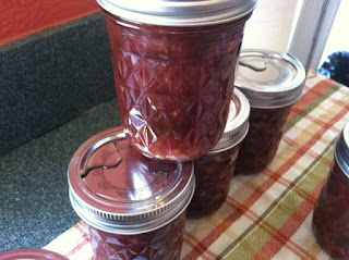 Canning cranberry chutney in jars