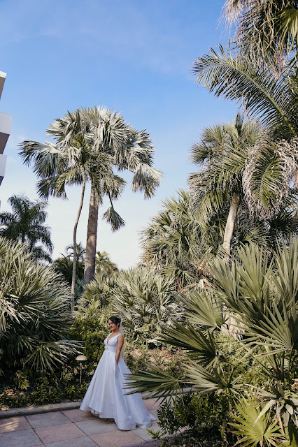 bride with palms at naples beach hotel