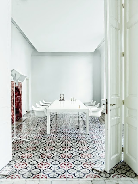 minimalist dining room with fireplace and tile floor