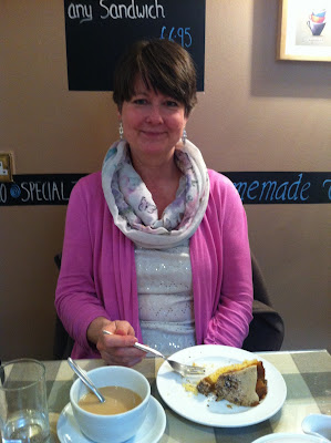 Mom with her coffee and walnut cake in Molly's Tea Room