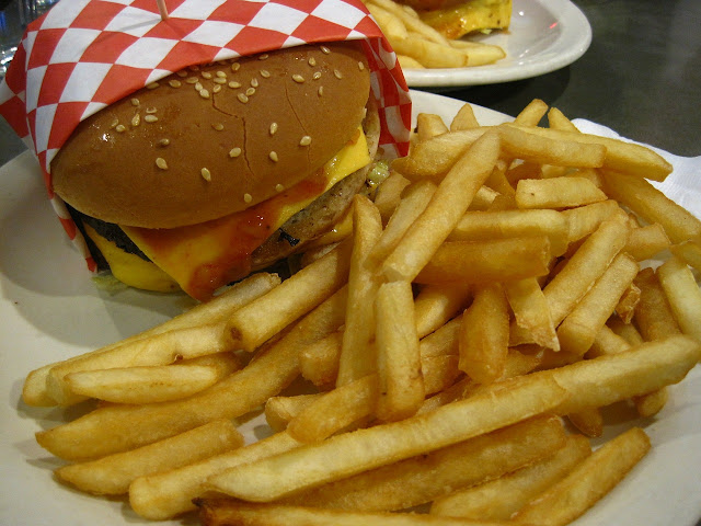 Cheeseburger and huge pile of fries