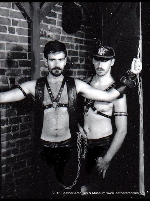 Black and white two leathermen Master/Slave posing sexy