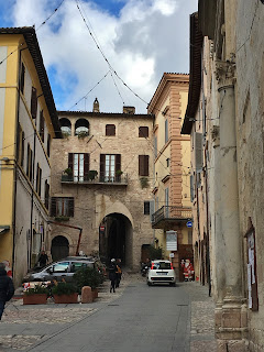 One of the many medieval arched gates of Spello, Umbria, Italy