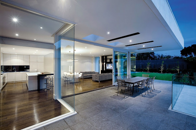 Open glass walls of modern home from the terrace 