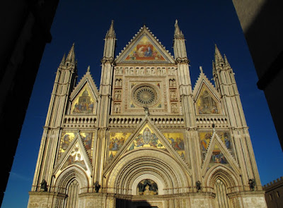 Orvieto Cathedral's glistening gold facade in the sunshine