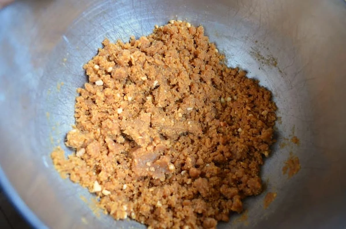 Crumbly Flourless Peanut Butter Cookie dough in a mixing bowl.