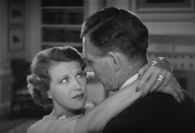 Ruth Chatterton hugging Walter Huston with a worried look in the 1936 movie Dodsworth