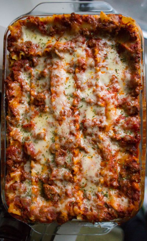 Hands down the best Lasagna Recipe ever! Easy, cheesy, meaty and so so delicious! Cuts perfect slices every time.