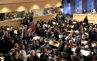 Delegates cheer after they approved the membership of Palestine during Monday's session of UNESCO's 36th General Conference in Paris.