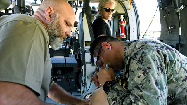 A GSN student works to intubate a training mannequin within the confined space of a Black Hawk helicopter. (Photo credit: Ian Neligh, USU)