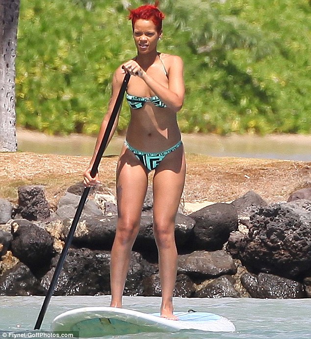 rihanna tattoos gun. Bikini Rihanna - Gun Tattoo On