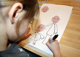 ...and body parts. She thought about how to layer each family member as she drew.