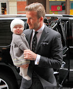 David Beckham and Harper Beckham outside Victoria Beckham's show in New York .