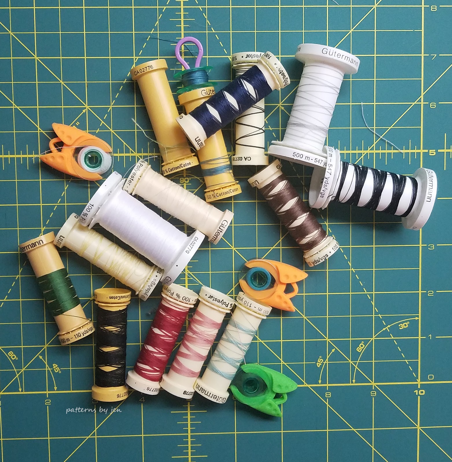 My husband made me a 100 thread spool and bobbin holder for my