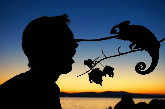 Fotógrafo se diverte com silhuetas de papelão no Pôr do Sol