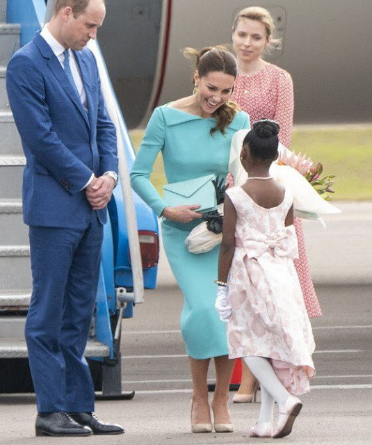 Kate Middleton wore a bespoke aquamarine fitted dress by Emilia Wickstead. Sezane Taylor earrings in turquoise