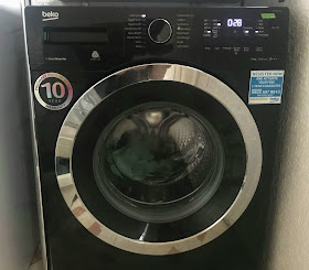 Back Beko Washing Machine in use washing laundry