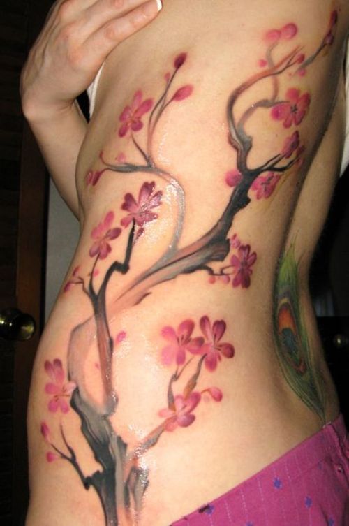 tree tattoos on side. small cherry tree tattoos.