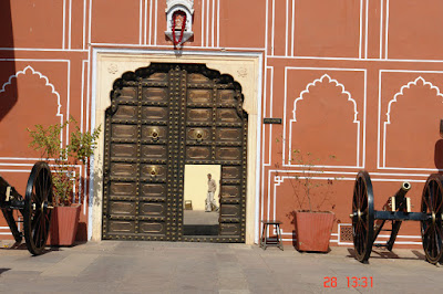Photo of a Person framed in the open doorway inside the Jaipur City Palace
