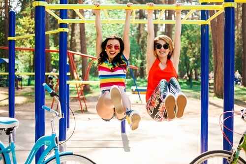 Happy with friends while enjoying the slide