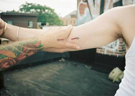 A Volunteer from New Zealand and her friend have matching tattoos