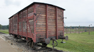 Auschwitz Train Car Photo by antoinettez at https://pixabay.com/photos/auschwitz-train-transportation-war-2205225/