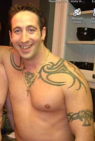  chest and an Irish Pride script tattoo on his inner right forearm